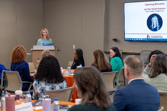 First Partner Jennifer Siebel Newsom giving opening remarks.